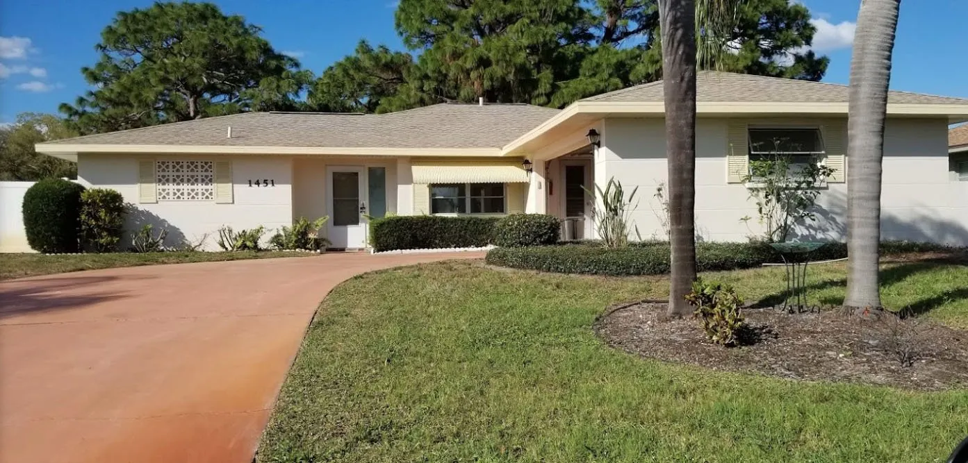 Single-story house with a fresh coat by Paint Masters Painting Contractors LLC in Venice, FL.
