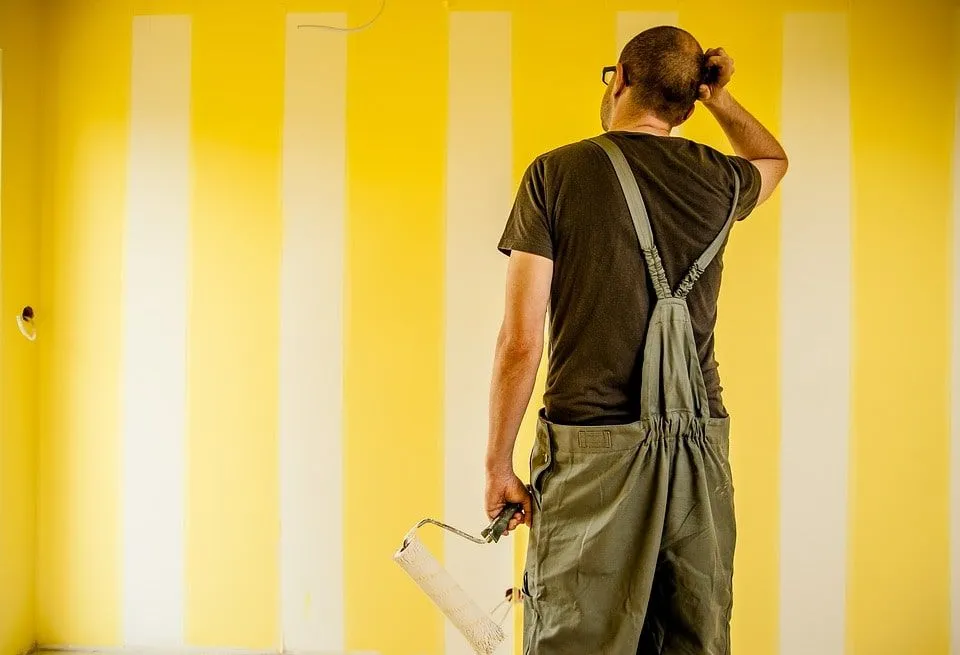 Painter from Paint Masters Painting Contractors LLC working on an interior project in Venice, FL.